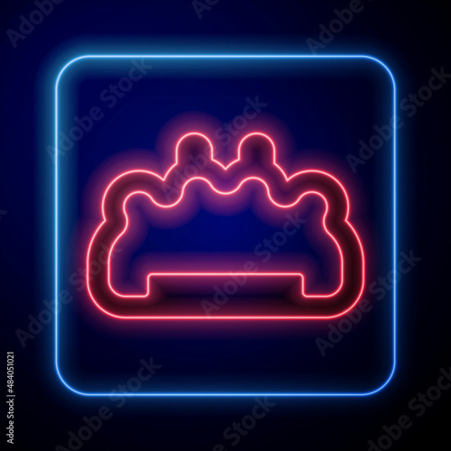 Glowing neon Brass knuckles icon isolated on black background. Vector