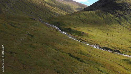Aerial view of river and waterfall in the highlands in Scotland