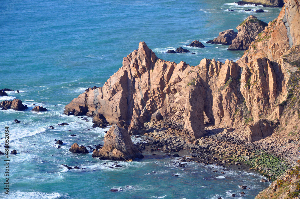 Rocky cliff at Cabo da Roca which is the most westerly point of the Europe mainland in town of Sintra, Lisbon District, Portugal.