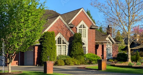 Wallpaper Mural Establishing shot of two story stucco luxury house with garage door, big tree and nice Spring Blossom landscape in Vancouver, Canada, North America. Day time on May 2021. ProRes 422 HQ. Torontodigital.ca