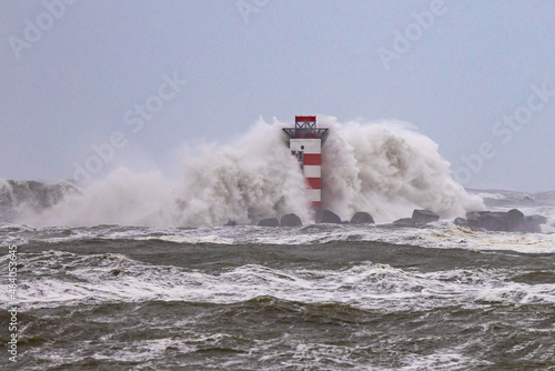 Storm Corrie Netherlands hitting lighthouse in IJmuiden, Netherlands