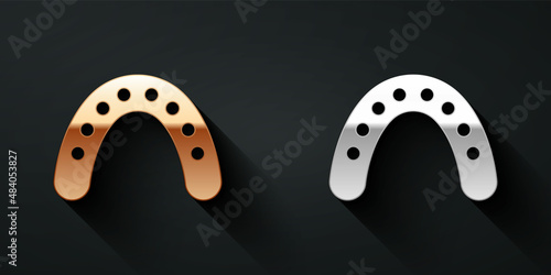 Gold and silver Mouth guard boxer icon isolated on black background. Long shadow style. Vector