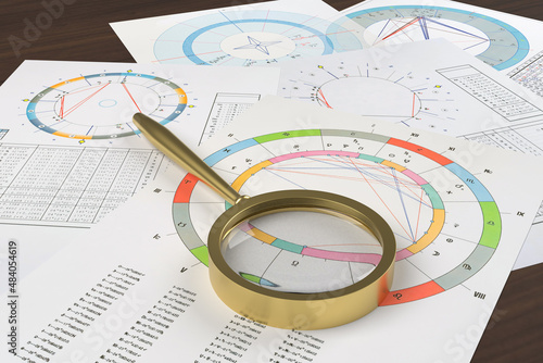 Fotografia Astrological charts on the astrologer's table, the workplace of a modern astrologer