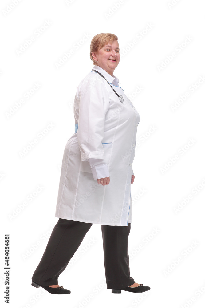 Profile of serious doctor woman walk isolated over white studio Profile of serious doctor woman walk isolated over white studio