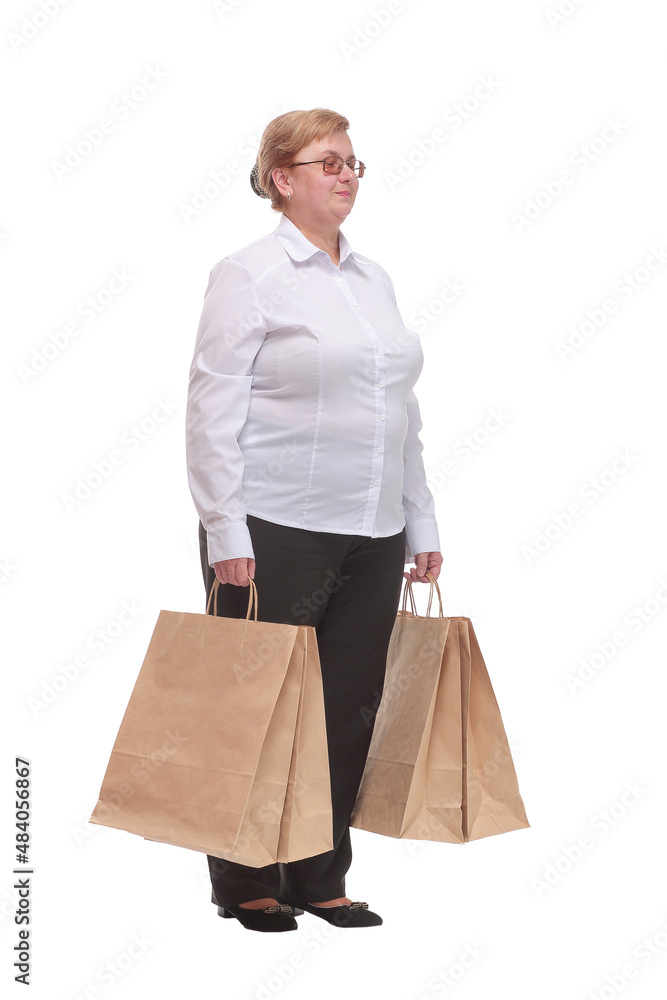 Image of smiling woman looking at camera and standing with her shopping bags Image of smiling woman looking at camera and standing with her shopping bags