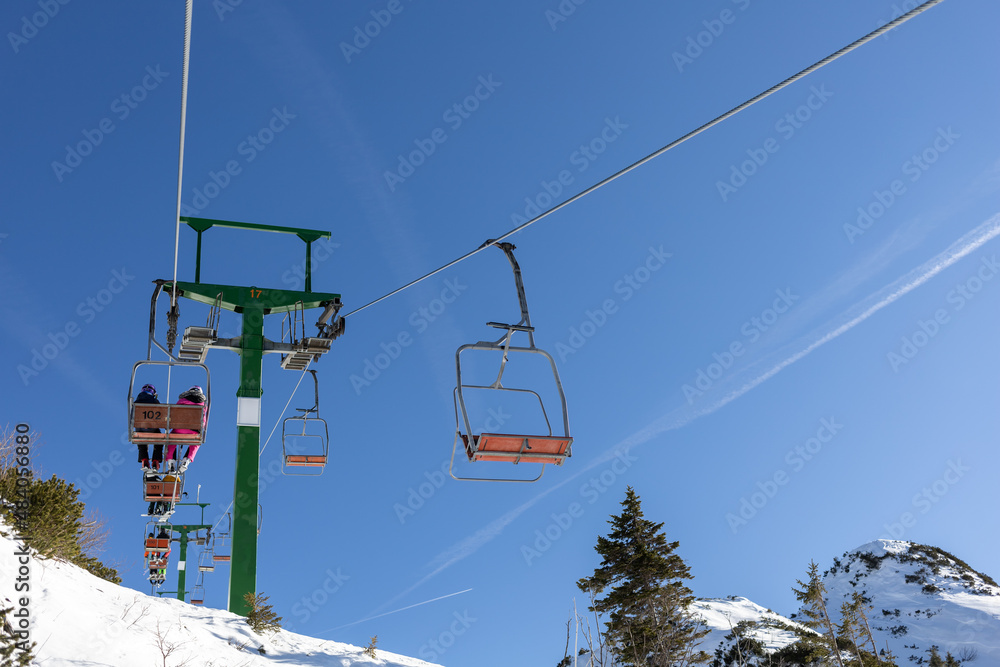 old chairlift at mountain ski resort on sunny day old chairlift at mountain ski resort on sunny day