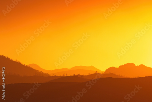 sunset over the mountains with copy space no people