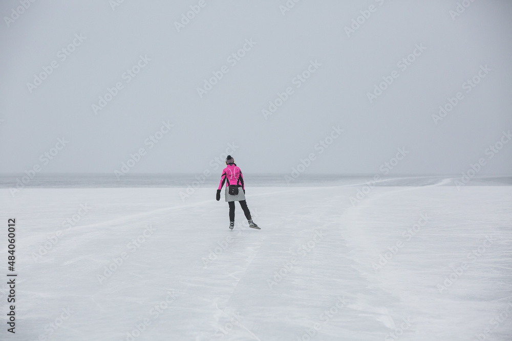 skater on a frozen lake