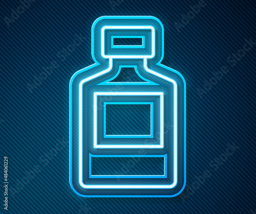 Glowing neon line Whiskey bottle icon isolated on blue background. Vector