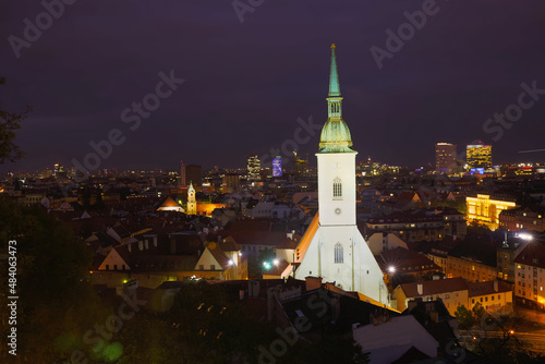 Night view of Bratislava old town and illuminated at dusk St. Martin's Cathedral..