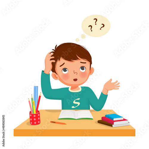 little boy with question mark scratching head, confused and having problems when doing his difficult math homework at the desk