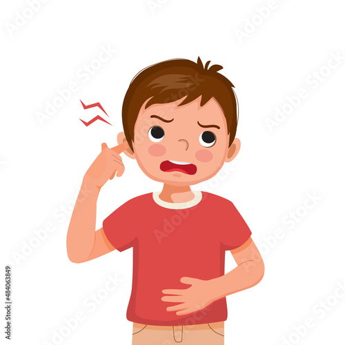 little boy has earache touching his ear with finger because of infection, inflammation, feeling painful inside