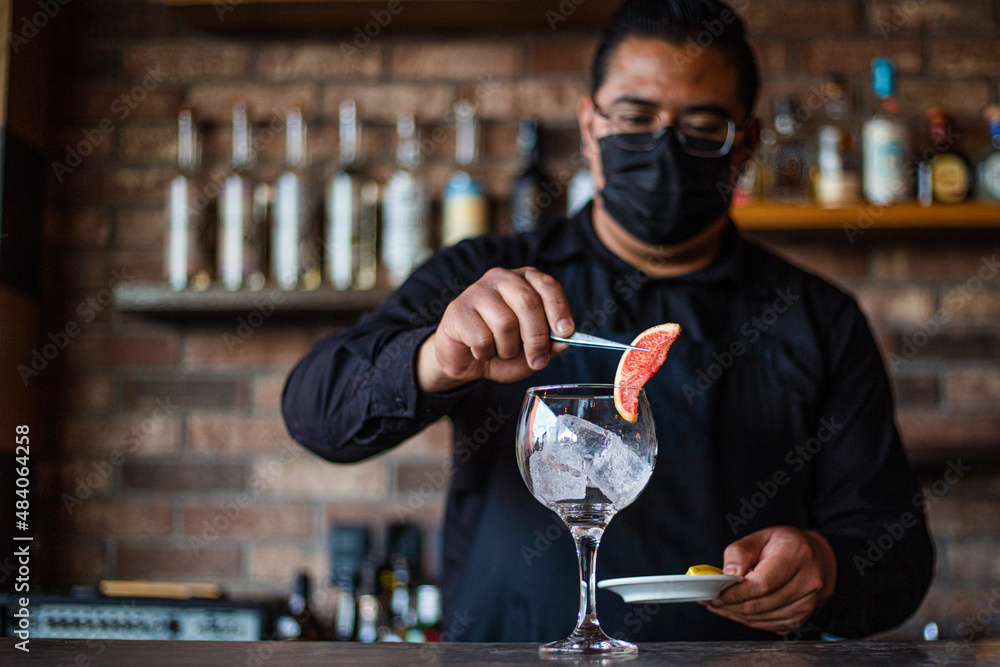 Bartender preparing a cocktail at the bar