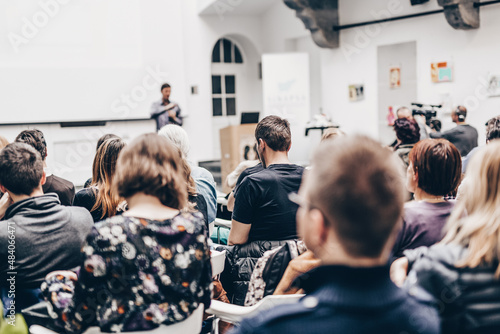 Man giving presentation in lecture hall at university.