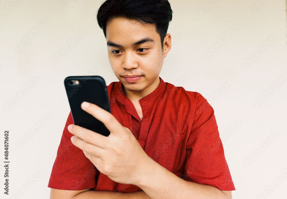 young man using mobile phone for shopping online and surfing internet, technology and communication concept young man using mobile phone for shopping online and surfing internet, technology and communication concept