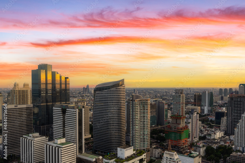Aerial view of modern office buildings in Bangkok downtown with sunrise time, Bangkok, Thailand