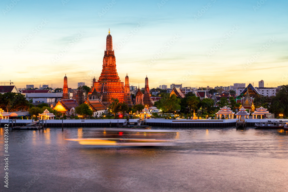 Wat Arun and Chao Phraya River with beautiful sunset sky background, Bangkok, Thailand