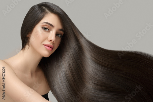 Fashion woman with straight long shiny hair. Beauty and hair care photo