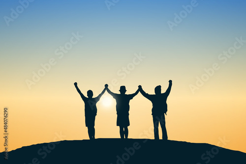 Silhouette group of people on top the mountain. Illustration sunset background. Business, teamwork, goal and success concept.