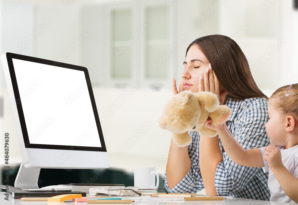 Beautiful young mother working for computer it home with little spoiled child . Mom or teacher and little girl child learn it home. Beautiful young mother working for computer it home with little spoiled child . Mom or teacher and little girl child learn it home.