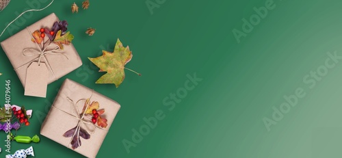 Banner with Christmas gift and decorations on desk background.