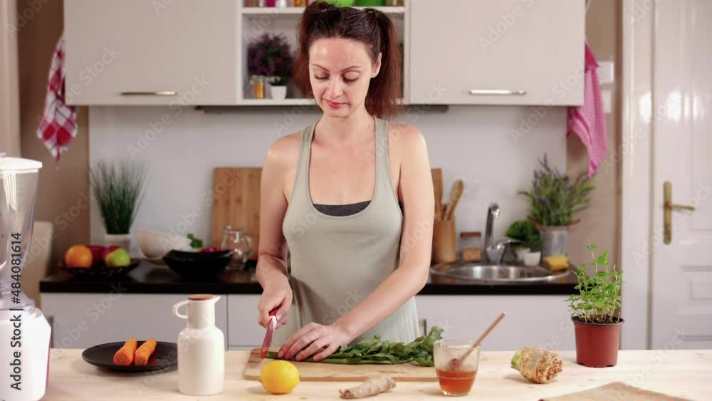 Young woman cooking in the modern kitchen Young woman cooking in the modern kitchen
