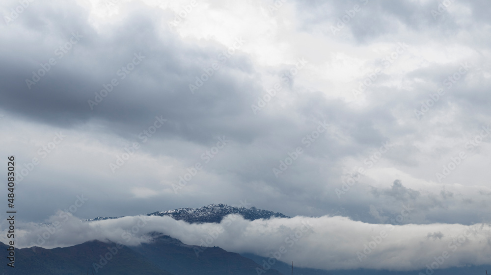 Beautiful clouds over a mountain in winter Beautiful clouds over a mountain in winter