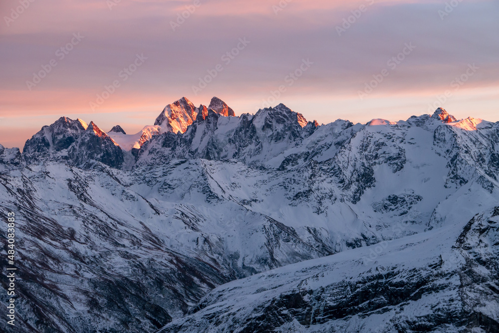 Snowy Greater Caucasus ridge. Mount. Ushba. Sunset. Panoramic view. Elbrus region, Kabardino-Balkaria, Russia