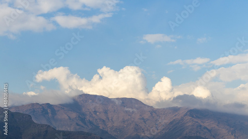 Scenery view of mountains with clouds and blue sky