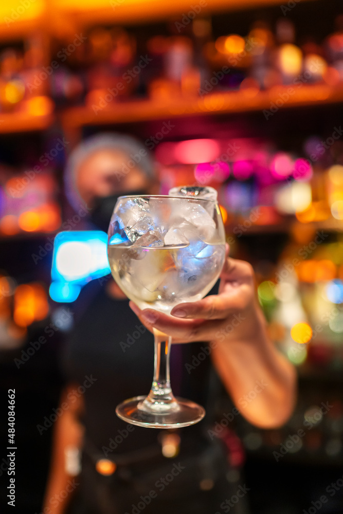 waitress serving a cocktail at her place waitress serving a cocktail at her place
