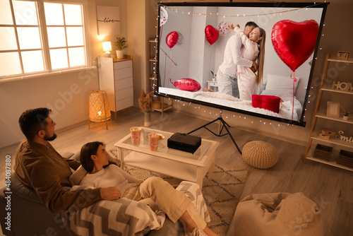 Young couple watching roman...