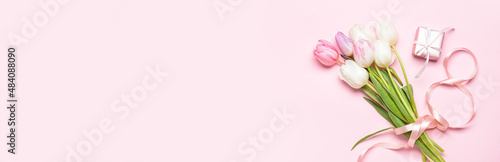 Gift box and tulip flowers for International Women's Day on color background with space for text #484088090