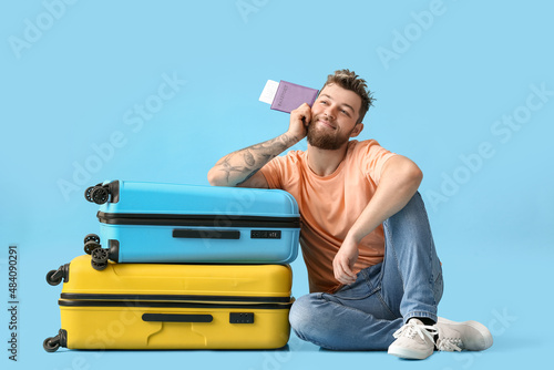 Happy young man with passpo...