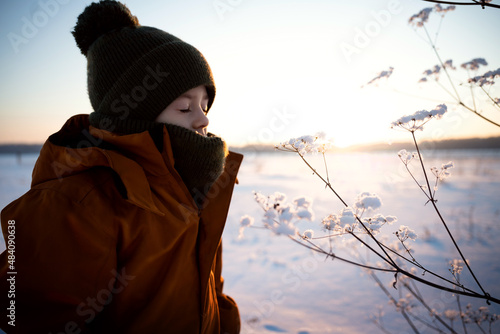 A little boy on a winter landscape