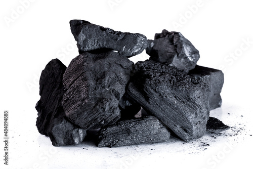 Pile of natural wood charcoal Isolated on white background. activated carbon.
