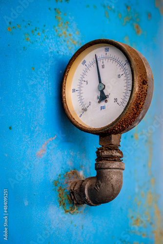 Pressure gauge (Pressure measurement) is measured by taking a reading from the dial. Industrial equipment, old rusted items that have been used.