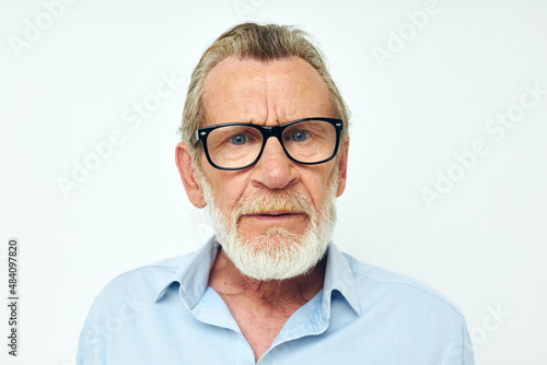 Senior grey-haired man lifestyle posing hand gesture isolated background