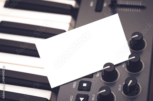Mockup of a business card that sticks out in a synthesizer or midi keyboard