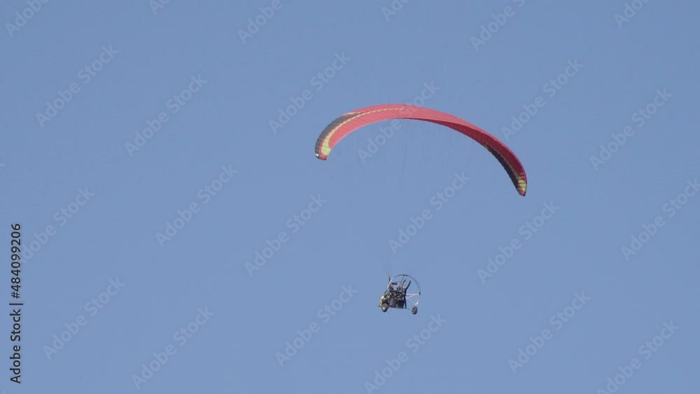 Isolated Shot Of A Solo Paraglider, Paragliding Is A Solo Extreme Sport Isolated Shot Of A Solo Paraglider, Paragliding Is A Solo Extreme Sport