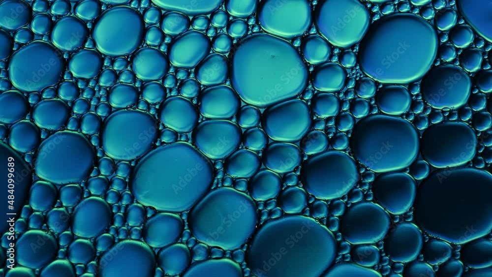 Abstract Colorful Food Oil Drops Bubbles and spheres Flowing on Water Surface, macro Videography Abstract Colorful Food Oil Drops Bubbles and spheres Flowing on Water Surface, macro Videography