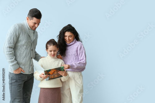 Little girl with her parent...