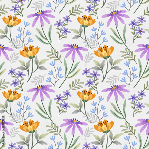 Cute small yellow and purple flowers seamless pattern. © teerawat
