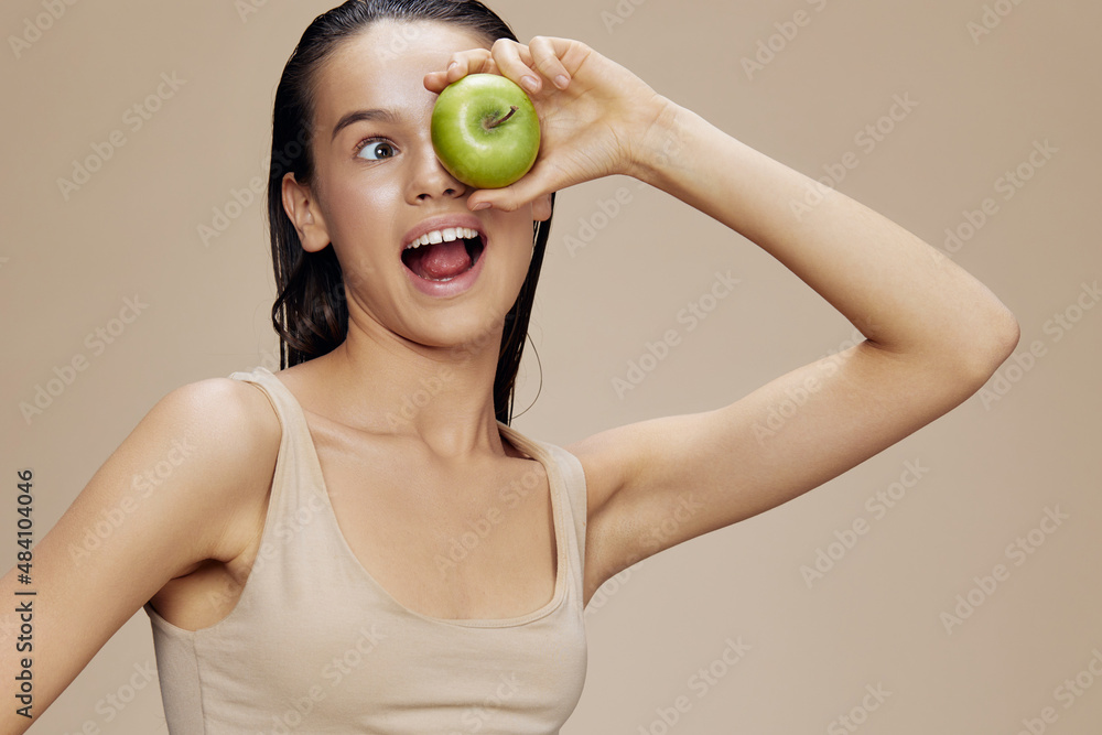 brunette apple in hands posing fruit healthy food fresh isolated background brunette apple in hands posing fruit healthy food fresh isolated background