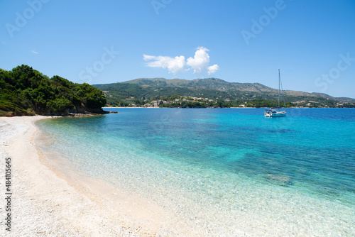 Fototapeta Naklejka Na Ścianę i Meble -  Beautiful bay with sailing boat, Corfu island, Greece, Picturesque mediterranean landscape, famous travel destination in Europe.