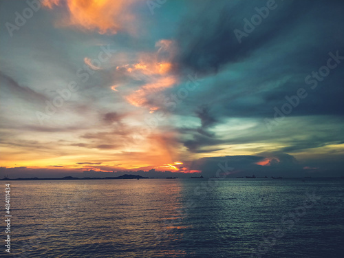 Beautiful sunset sky. Half orange, half blue.  © Parichart