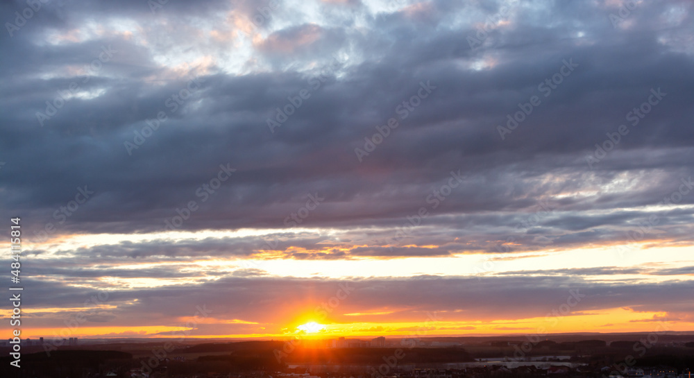 Beautiful clouds in the sky. Colorful sunset or dawn. landscape with sunbeams