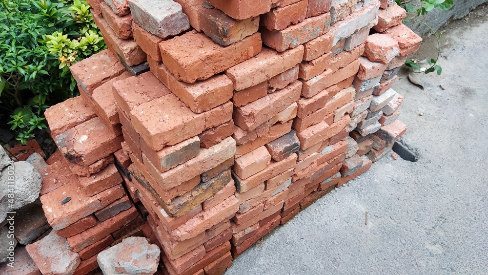 Pile of red bricks stone on the construction site to build a mosque