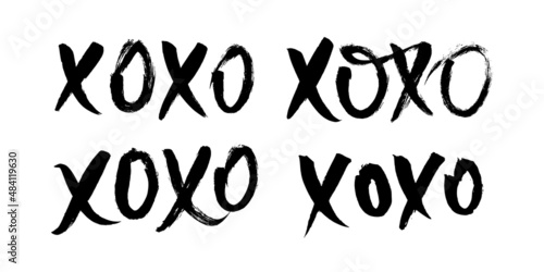 Xoxo Hugs and Kisses brush lettering set. Valentines day quote in handwriting ink grungy style. Romantic typography for holiday banner, greeting card and creative design.