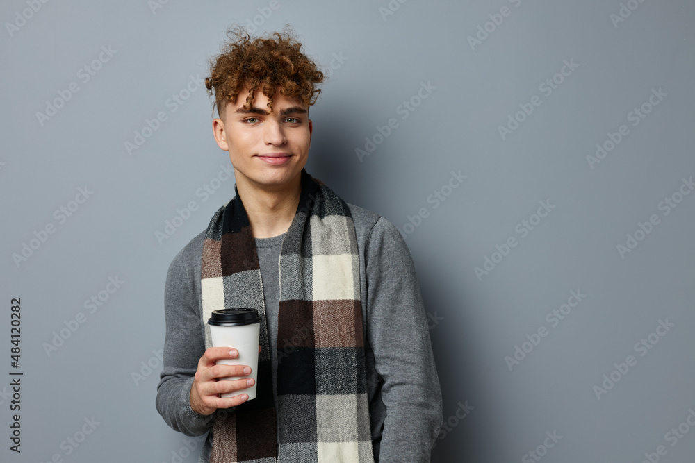 handsome young man smile checkered scarf glass in hand isolated background handsome young man smile checkered scarf glass in hand isolated background