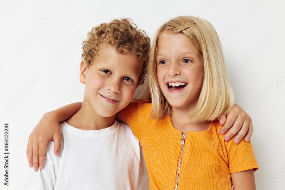 Cute preschool kids Friendship together posing emotions light background hold hands Cute preschool kids Friendship together posing emotions light background hold hands